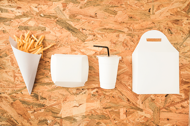 french fries disposal cup packages row wooden table